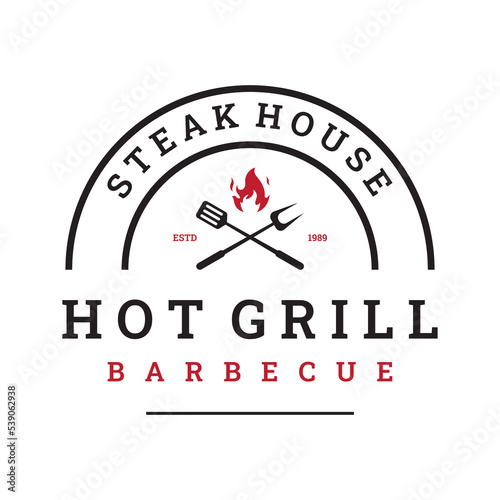 Grilled barbecue typography Logo design with crossed fire and spatula.Logos for restaurants, cafes and bars.