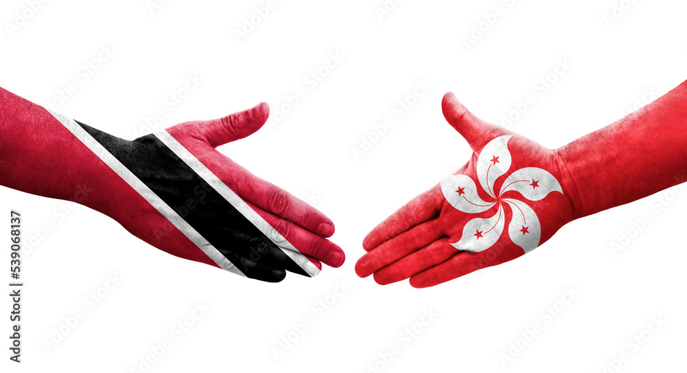 Obraz premium Handshake between Hong Kong and Trinidad Tobago flags painted on hands, isolated transparent image.