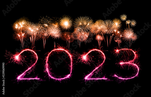 2023 happy new year fireworks celebration written sparkling at night.
