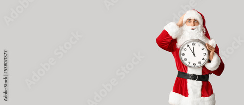 Surprised Santa Claus holdi...