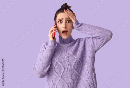 Worried young woman with bi...