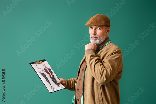Mature fashion designer wit...