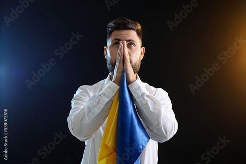 Young man with flag of Ukra...