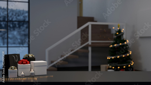 Copy space on black tabletop with surprise gift boxes over blurred living room with Christmas tree