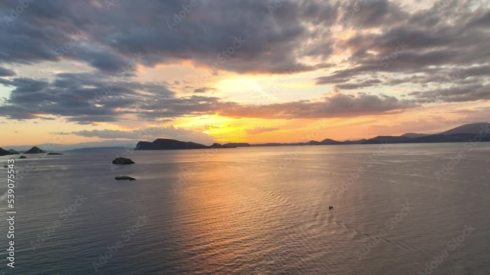 Sunset on Greek islands, flying towards sunset over the Mediterranean Sea in Greece, getting away from it all on a Greek island Sunset on Greek islands, flying towards sunset over the Mediterranean Sea in Greece, getting away from it all on a Greek island