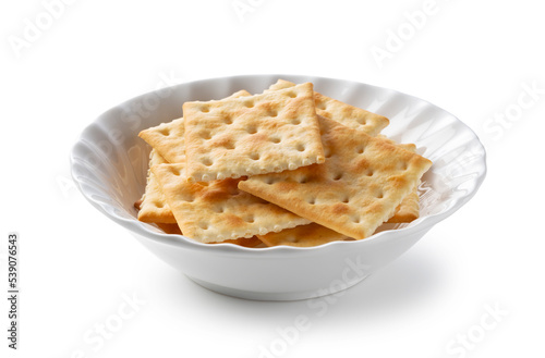 Bilde på lerret Crackers in a dish placed on a white background.