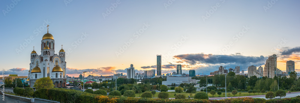 Fototapeta premium Temple in autumn in beautiful orange sunset light. Temple on Blood, Yekaterinburg, Russia