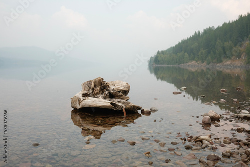 Wildfire smoke on lake at Lake McDonald, Montana photo