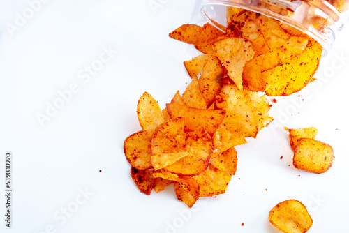 Crackers made of cassava or tapioca. Sliced, fried and sprinkled with spicy seasoning. Famous in East Asia  photo