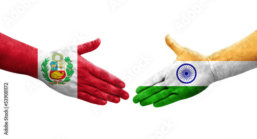 Handshake between India and Peru flags painted on hands, isolated transparent image.