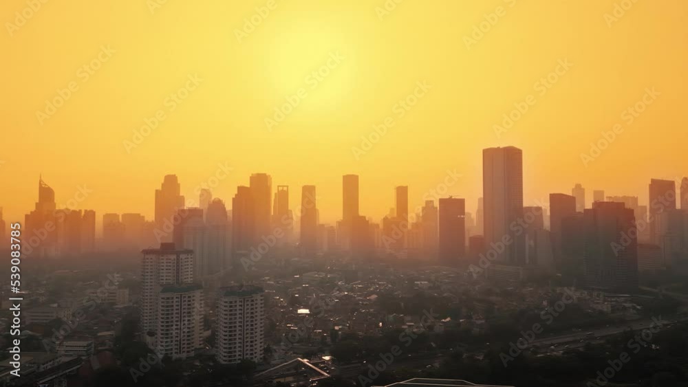 Urban houses with skyscraper at dusk in Jakarta Urban houses with skyscraper at dusk in Jakarta