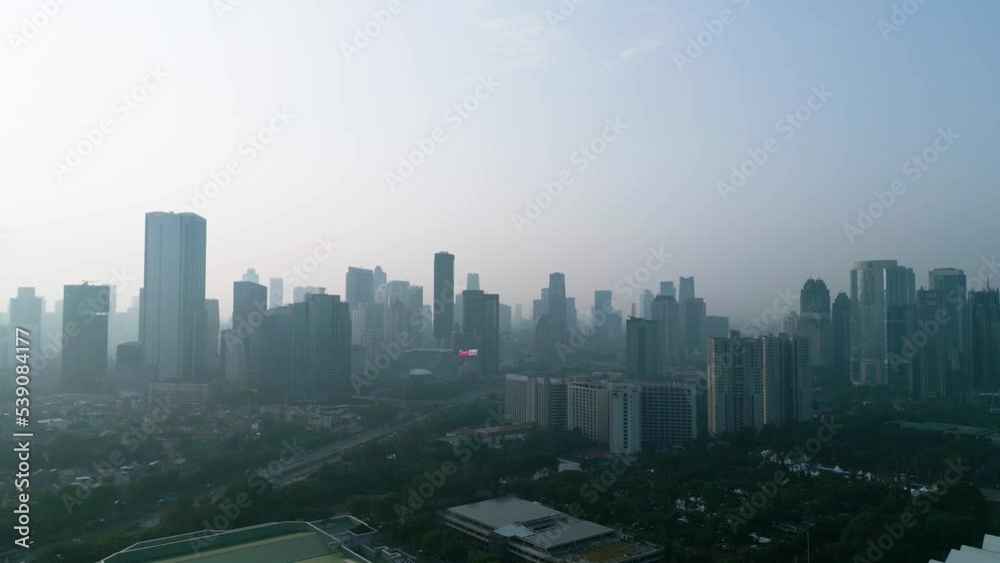 Aerial view of highrise buildings covered foggy Aerial view of highrise buildings covered foggy