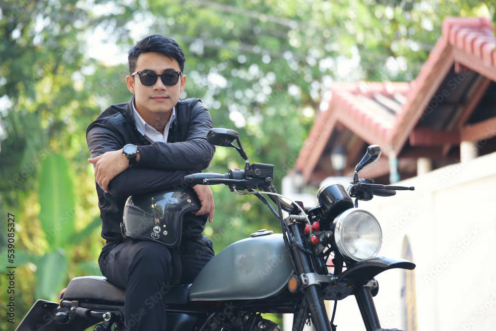 Asian man motorbike in black leather jacket travel rider trip. Handsome Men wear sunglass outdoor lifestyle freedom rider. Men trendy hipster cool person. Young asian man hobby ride with motor bike Asian man motorbike in black leather jacket travel rider trip. Handsome Men wear sunglass outdoor lifestyle freedom rider. Men trendy hipster cool person. Young asian man hobby ride with motor bike