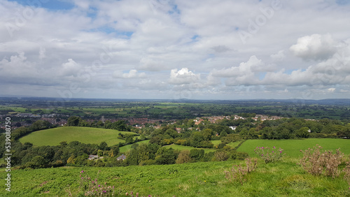 Beautiful view of rural countryside, rolling green meadow fields and farmland landscape in Glastonbury on the Somerset Levels, West Country in England, UK