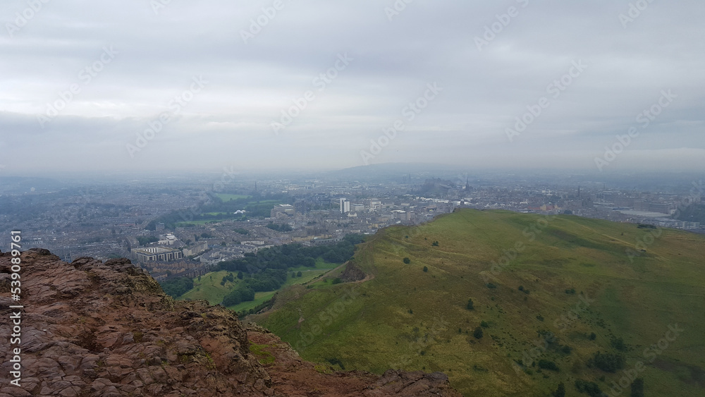 The summit of Arthur's Seat in Holyrood Park, ancient volcano, with stunning panoramic landscape views overlooking Edinburgh in Scotland