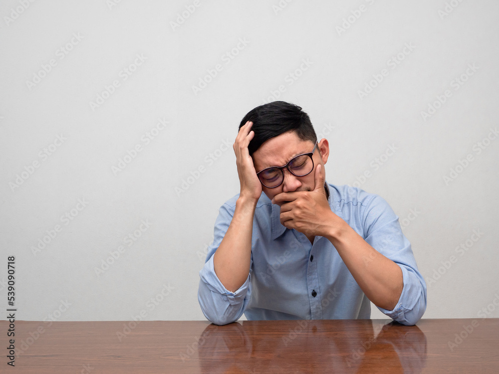 Sadness businessman sit alone crying and disheartened Sadness businessman sit alone crying and disheartened