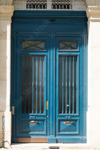 Rustic Double Wooden Door blue on french wall city street classic facade