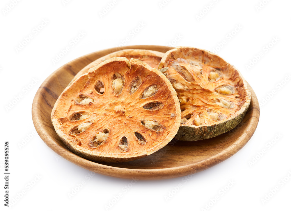 dry Indian bael fruit in wood plate isolated on white background. Indian bael fruit in wood plate isolated. group of Indian bael fruit isolated dry Indian bael fruit in wood plate isolated on white background. Indian bael fruit in wood plate isolated. group of Indian bael fruit isolated