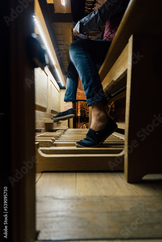 Картината върху платно Close-up of a organist playing organ pedals in church