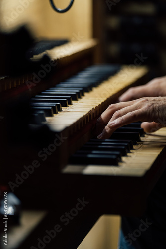 Картината върху платно Close-up of a organist playing organ keyboard in church