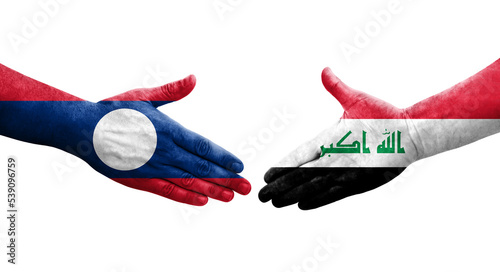 Handshake between Iraq and Laos flags painted on hands, isolated transparent image.