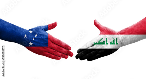 Handshake between Iraq and Samoa flags painted on hands, isolated transparent image.