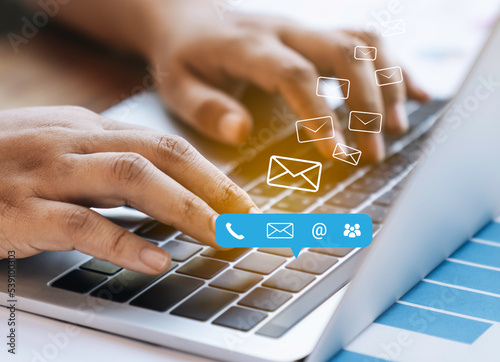 Contact us or Customer support hotline people connect. Business people using a laptop computer with the (email, call phone, mail) icons.