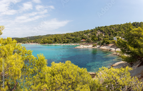 Kalogria Beach in Sithonia, Halkidiki with turquoise shining sea during summer time in Greece.