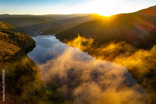 Colorful aerial view of Secu Lake in Caras-Severin - Romania  in the autumn  at sunrise. Scene captured from above  with a drone.