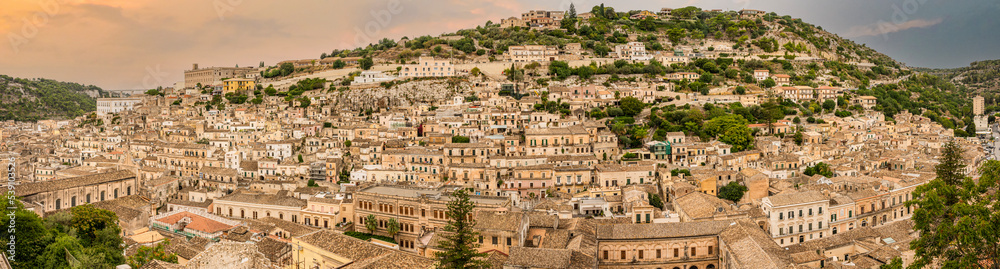 Extra wide angle view of the historic center of Modica at sunset