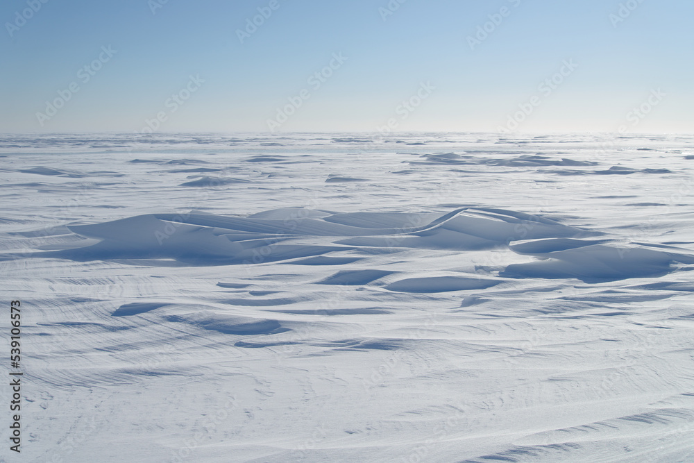 Snow drifts in the sunlight. Snow drifts in the sunlight.
