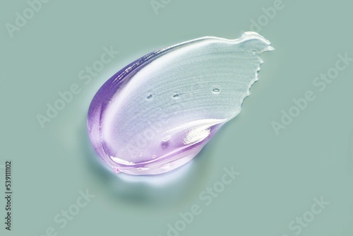 Liquid purple lavender violet gel cosmetic smudge swatch texture on emerald sage background