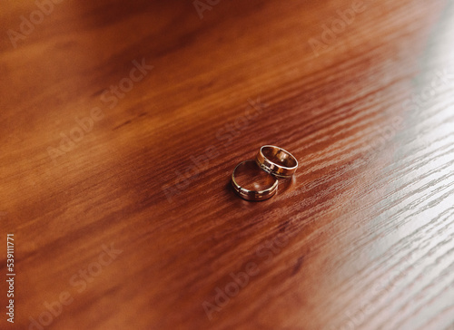 Two wedding rings on the floor with contrast