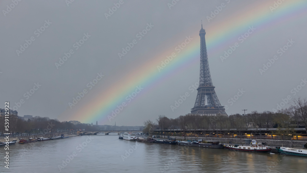 Rainbow scene in The Eiffel Tower, iconic Paris landmark  as autumn trees park  as Seine river  scene in Paris ,France