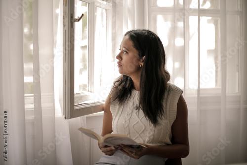 woman looking out window Free Download woman looking out window - GFXLoad