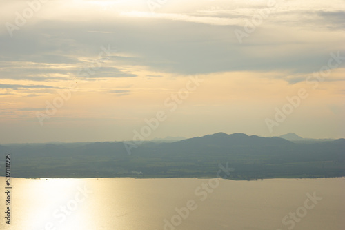 twilight beautiful yellow sky in reservoir © saravuth