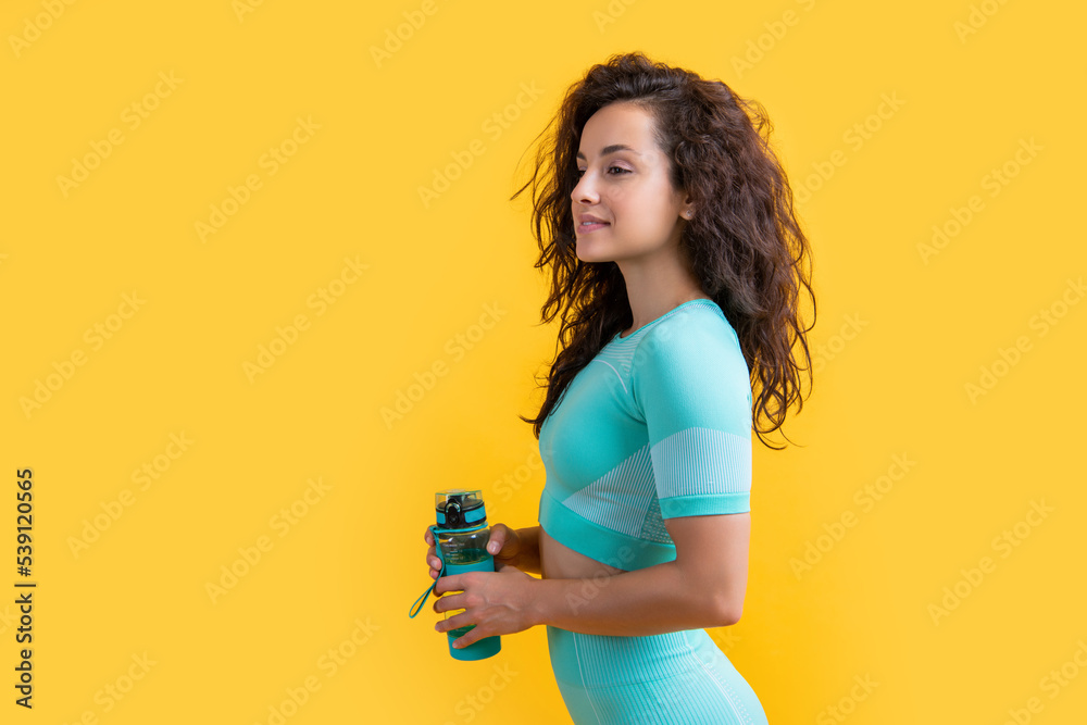 Ταπετσαρία smiling fitness sportswoman with sport water bottle in studio