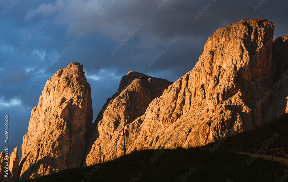 Obraz premium The landscape of the Dolomites seen from the Sella group: one of the most famous and spectacular mountain massifs in the Alps, near the town of Canazei, Italy - July 2022.