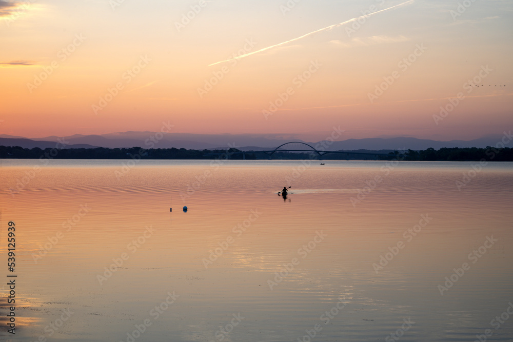 Kayaking on Lake Champlain at sunrise Kayaking on Lake Champlain at sunrise