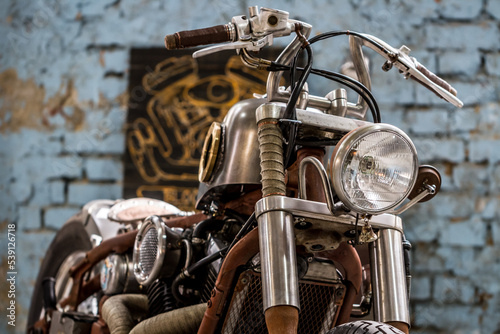 Close-up of retro motorcycle handles, lamp and switches