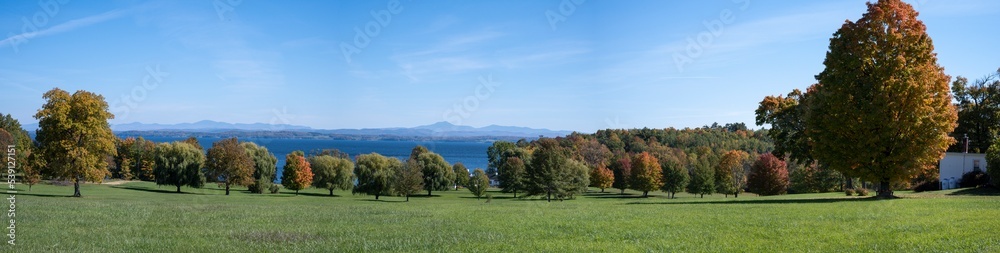 Panoramic view of Lake Champlain in the fall with the mountains of Vermont in the background