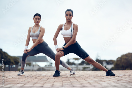 Exercise, women and stretching for wellness, outdoor and training for fitness, health and in sportswear. Female, girl and practice for workout, warm up and outside being focus, healthy and for cardio
