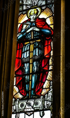 Vertical of a stained glass window in the Carisbrooke Castle, Isle of Wight photo