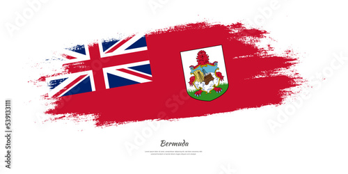 Happy Independence Day of Bermuda. National flag on artistic stain brush stroke background.