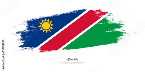 Free Download Happy Independence Day of Namibia. National flag on artistic stain brush stroke background. - GFXLoad