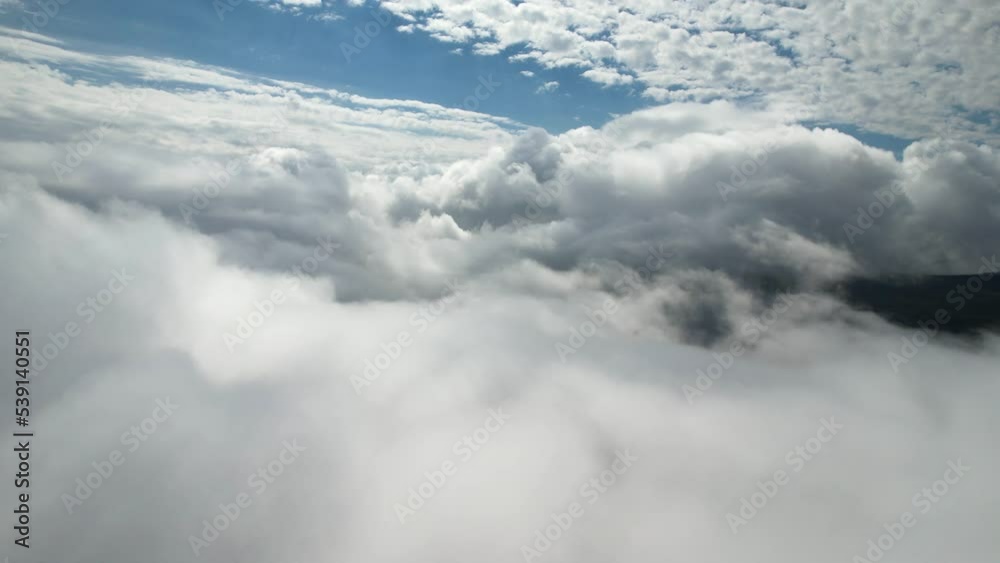 Aerial shot up high in the white clouds. Dramatic sight of the horizon. Cloudscape. Aerial shot up high in the white clouds. Dramatic sight of the horizon. Cloudscape.