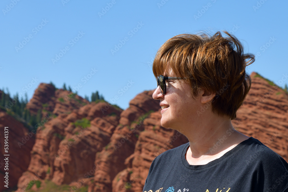 Naklejka premium Tourist in Seven bulls and a broken heart canyon in Kyrgyzstan