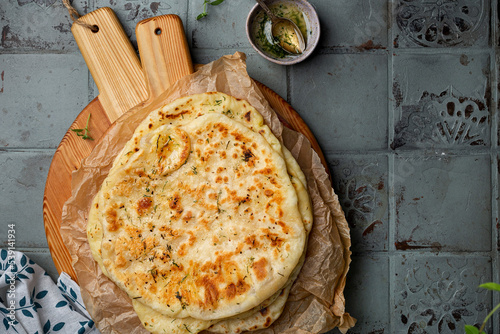 Indian bread Naan with cheese and garlic photo