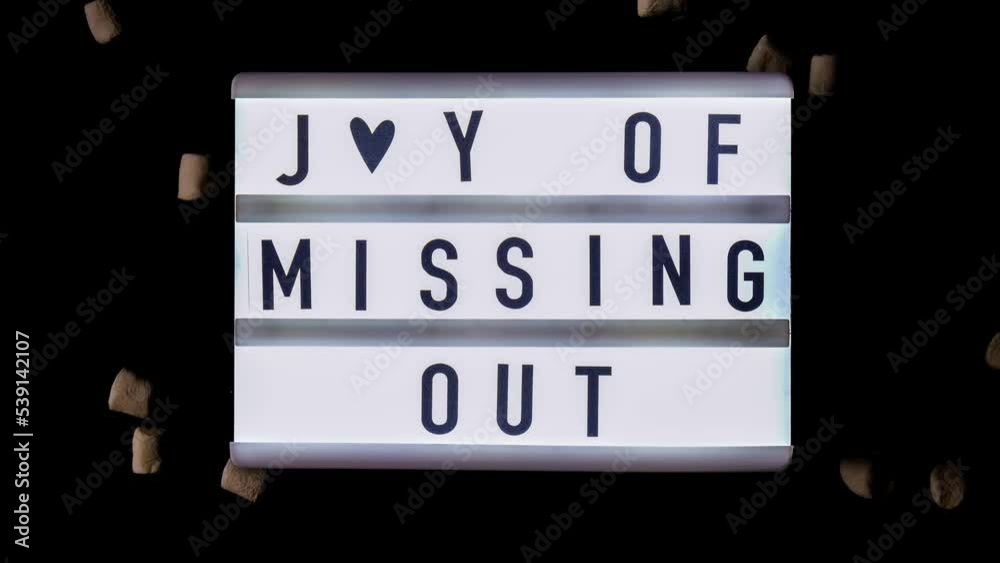 4k zoom in out Lightbox with text JOMO Joy of Missing Out. The concept of relaxation from information and gadgets. Top view. Flat lay. Digital detox