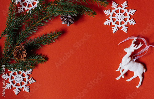 christmas background - pine tree branches  presents and decor on green copy space background